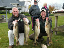 Wayne Farnsworth Jr. and Pooh Bear holding first place walleye from their Walleye Central 2008 Bragging Rights Tournament catch